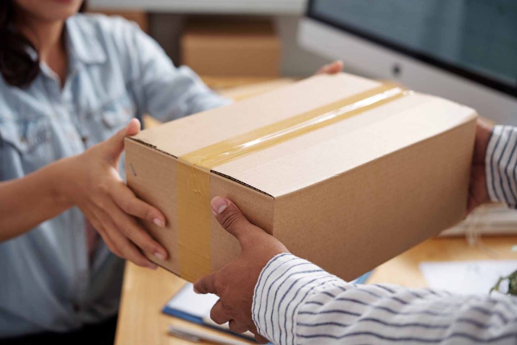 Giving parcel to courier